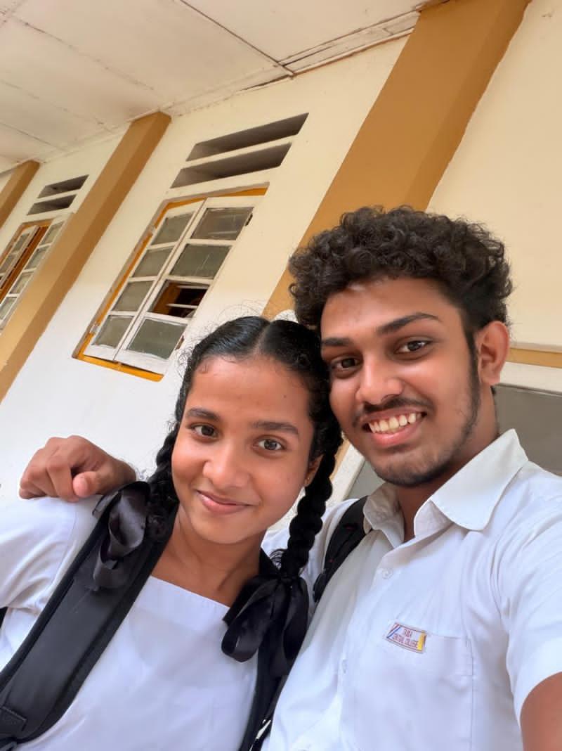 A close-up selfie of us smiling at school
